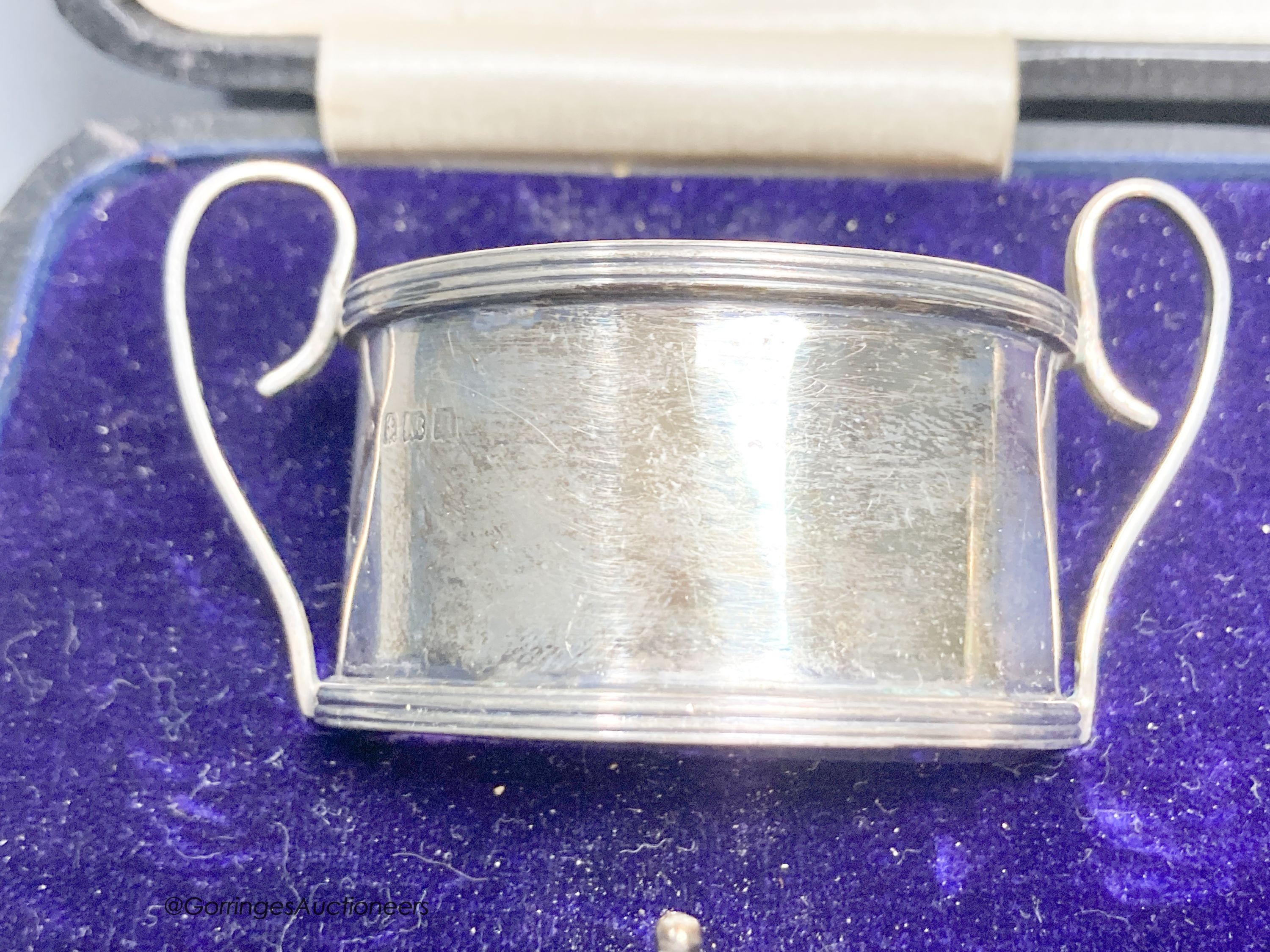 A cased George V silver five piece condiment set and two spoon, Birmingham, 1912.